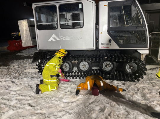 Preparing to lift the over snow vehicle. Digging out snow to find a firm surface.